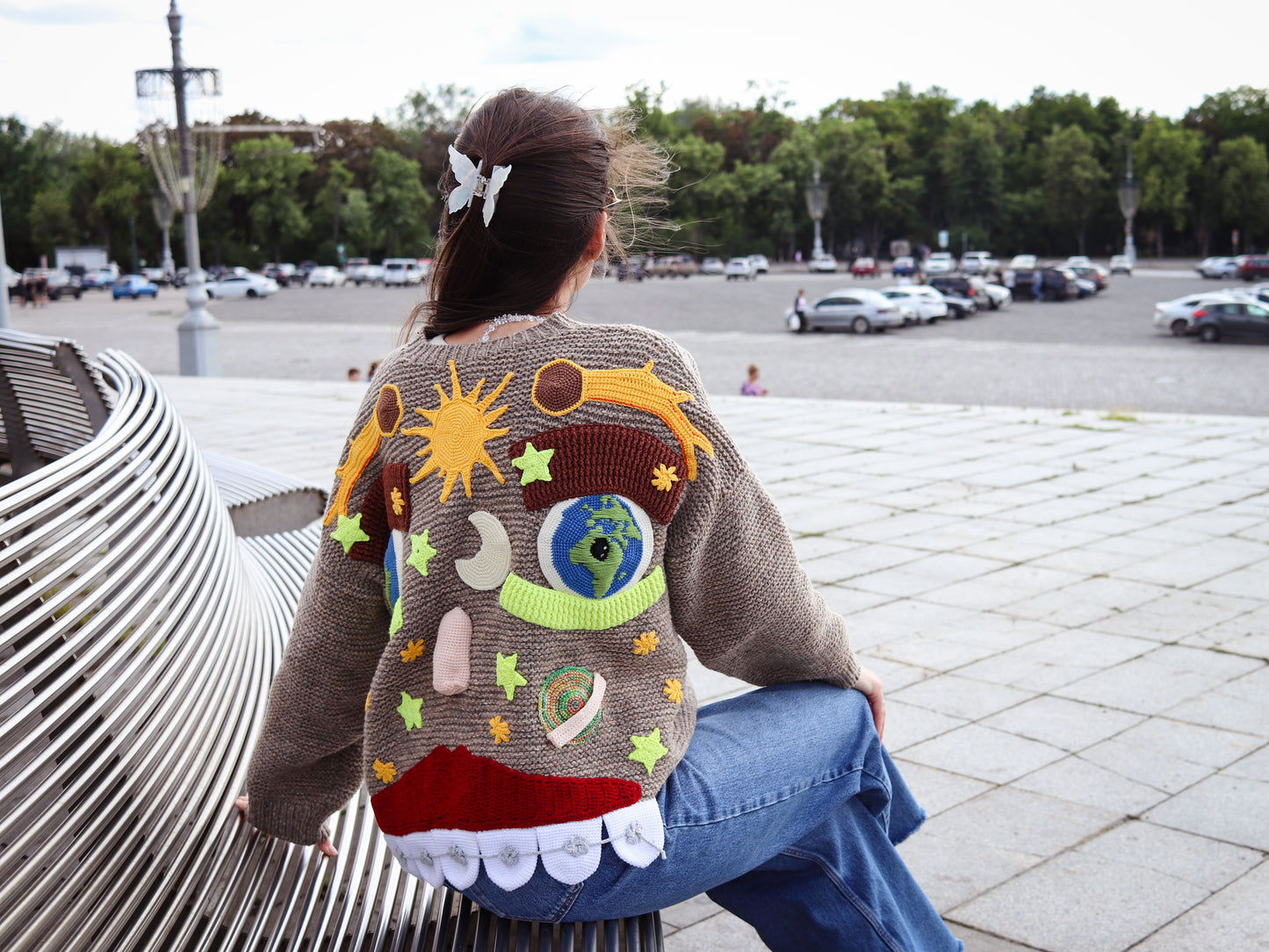 Close-up of teeth and bulging eyes on knitted face sweater