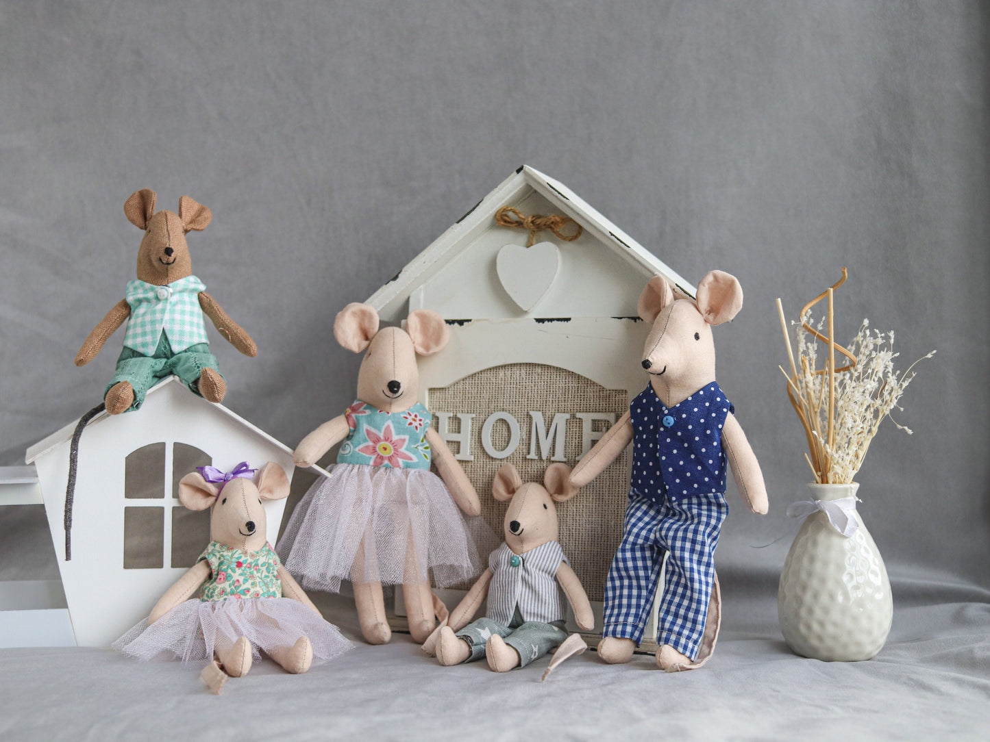 Handmade dollhouse mouse family set arranged in cozy scene