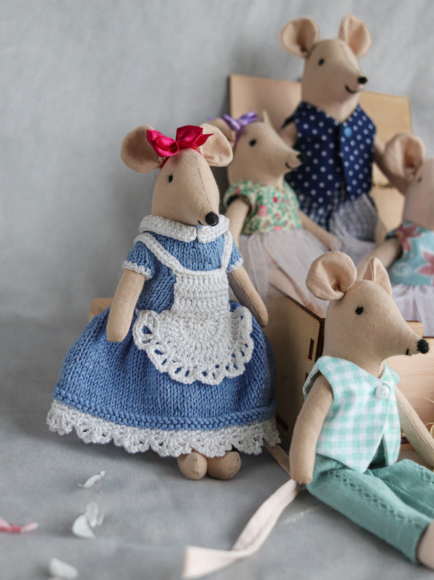 Collectible mouse figures displayed in whimsical background