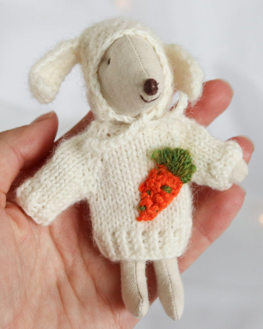 Maileg mouse wearing hand-knitted sweater and beanie hat